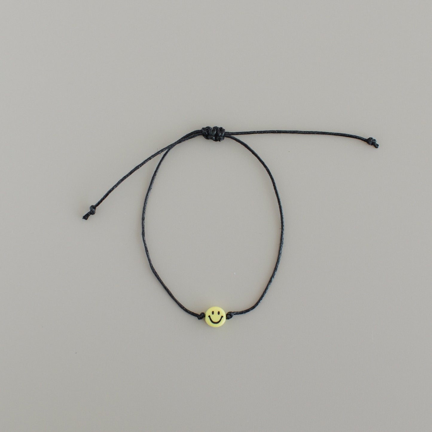 Smiley-Armband schwarz